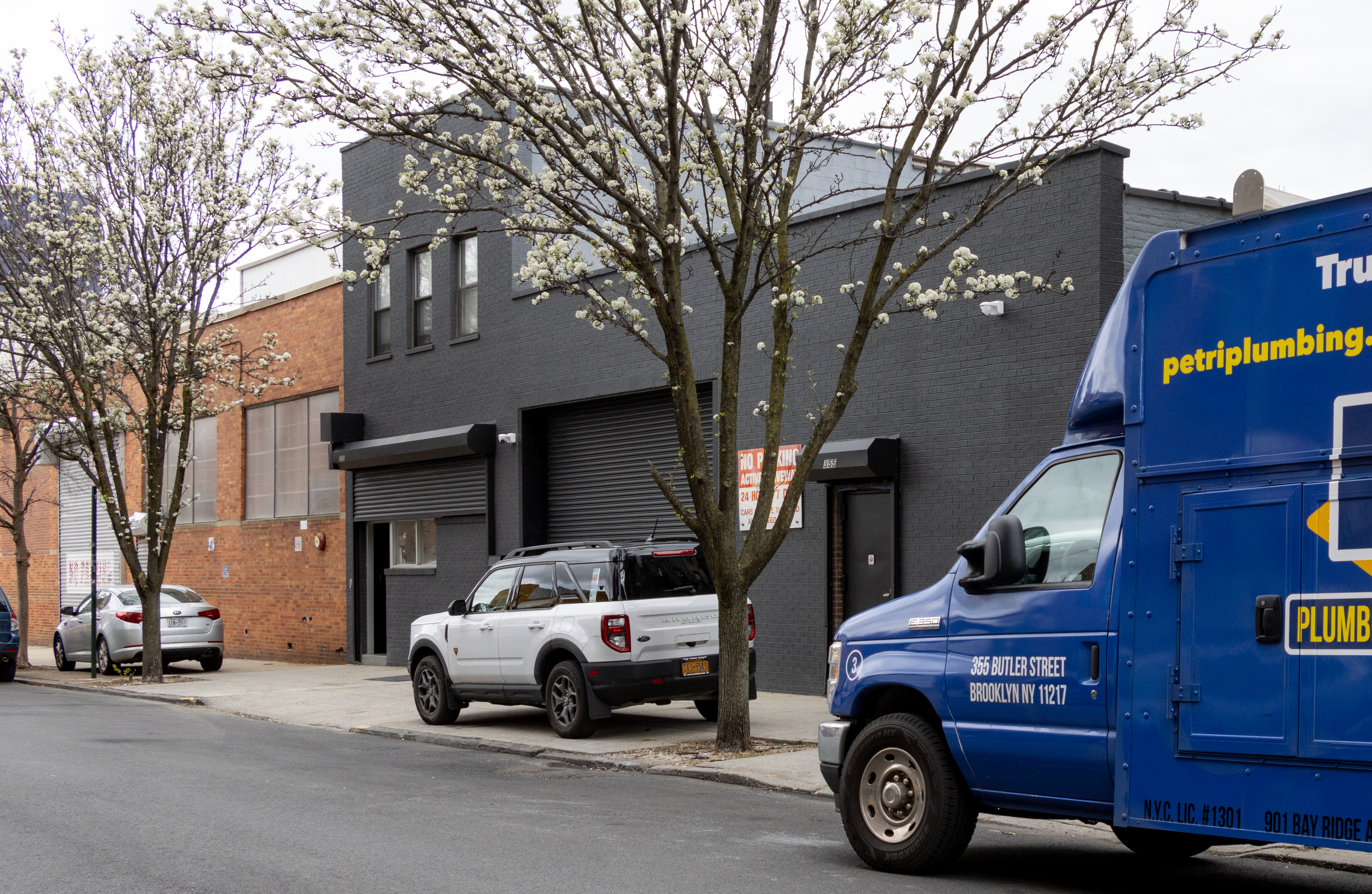 gowanus - commercial building with a plumbing truck parked in front