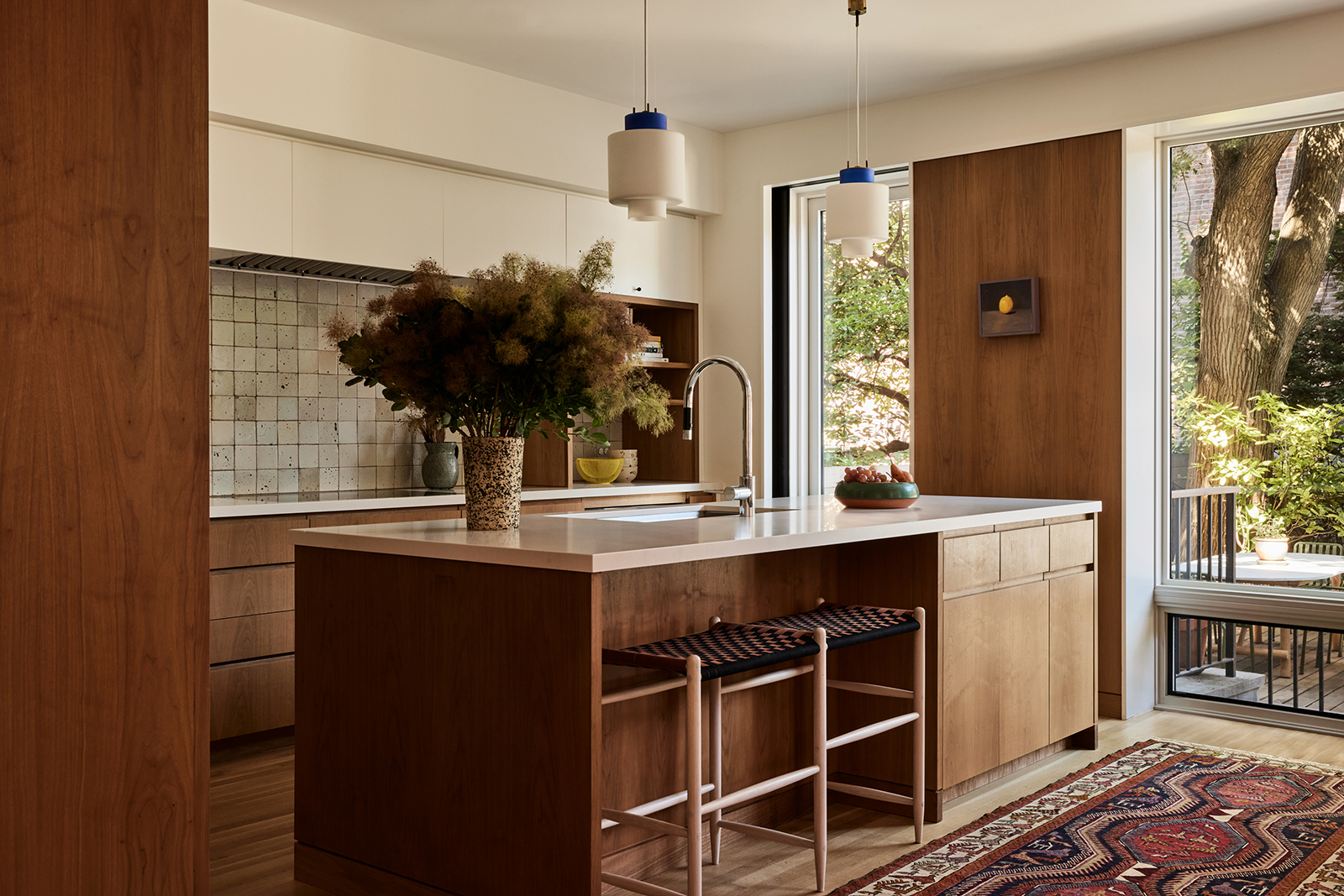 KITCHEN WITH TALL WINDOWS OVERLOOKING GARDEN