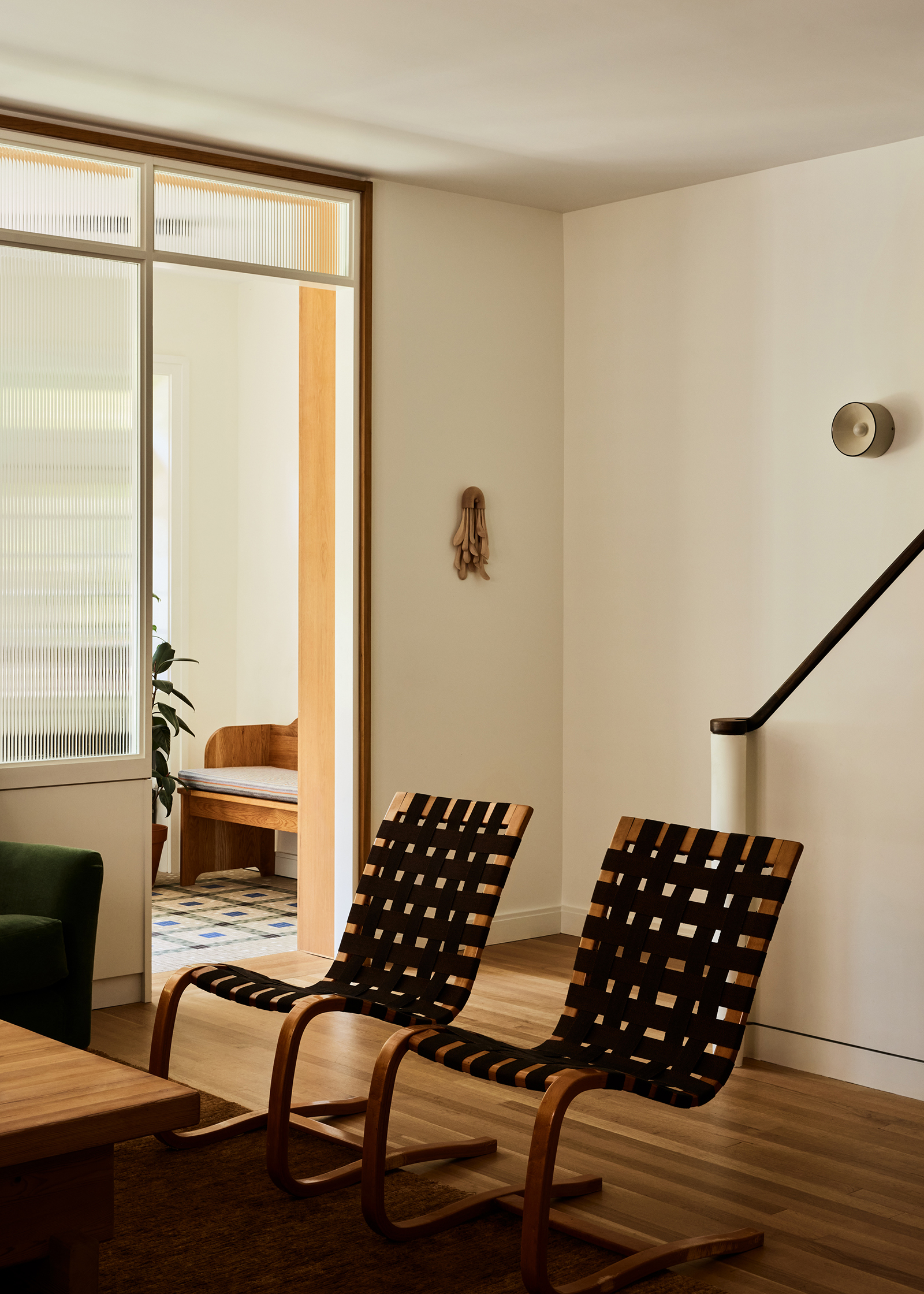 ENTRY REEDED GLASS WALL STAIRS WEBBED CHAIRS