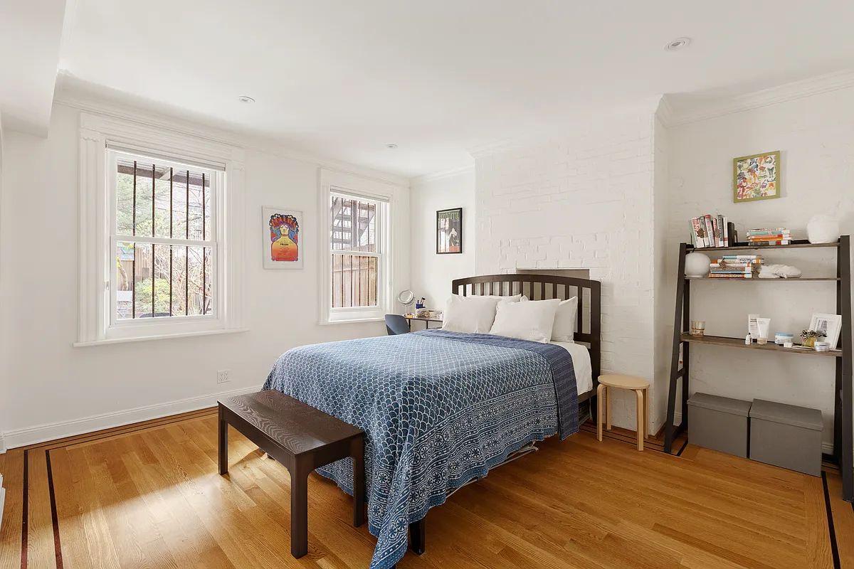 garden level bedroom with two windows