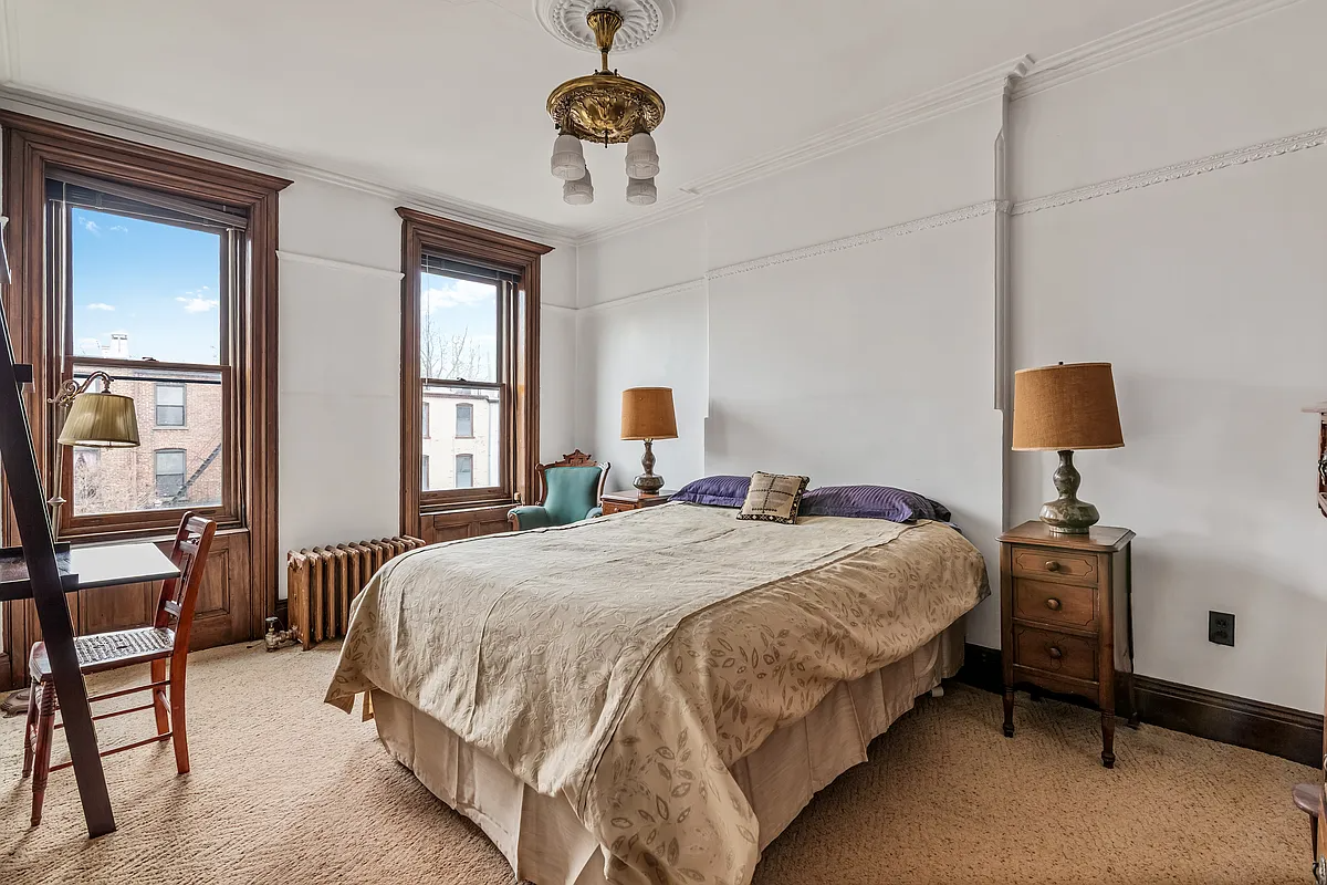 bedroom with picture rail, two windows, carpeting