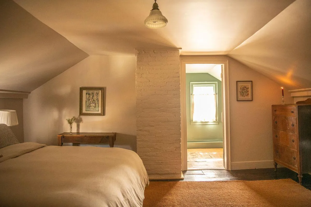 bedroom with angled ceiling