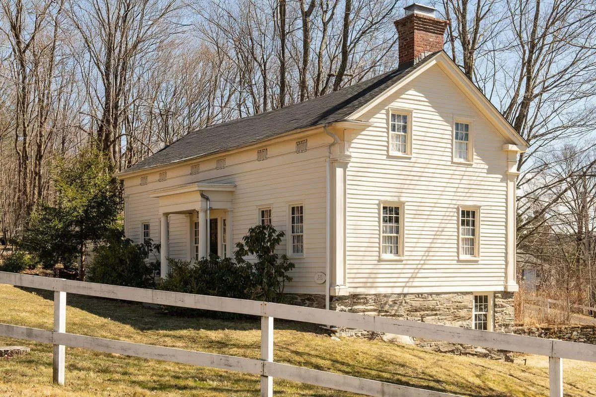 exterior of the five bay wide, greek revival house