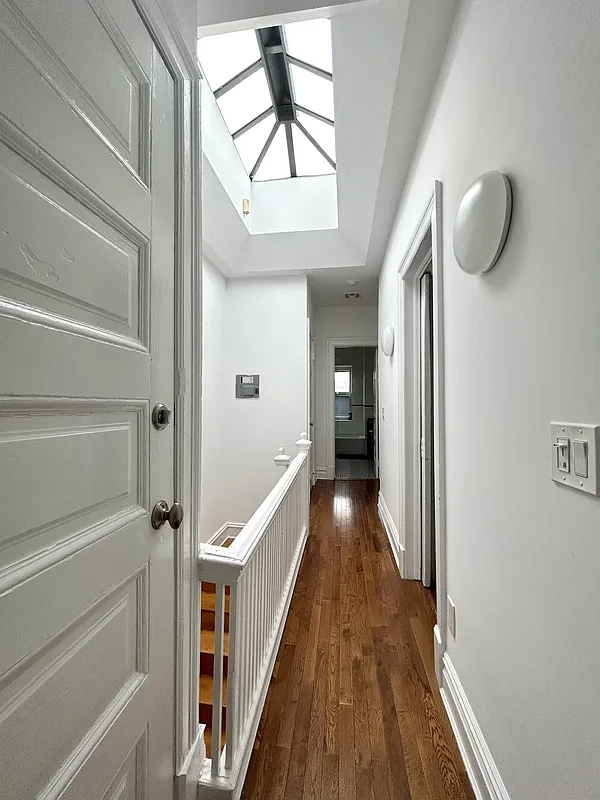 upstairs hall with skylight