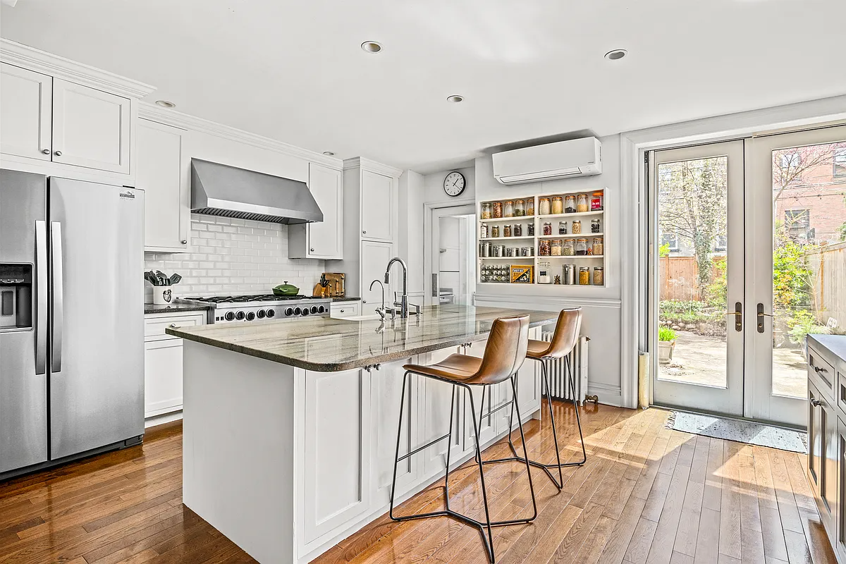 kitchen with white cabinets, french doors to garden