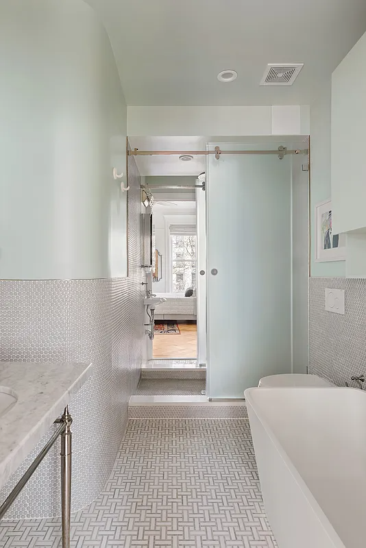 bathroom with sliding glass doors to shower