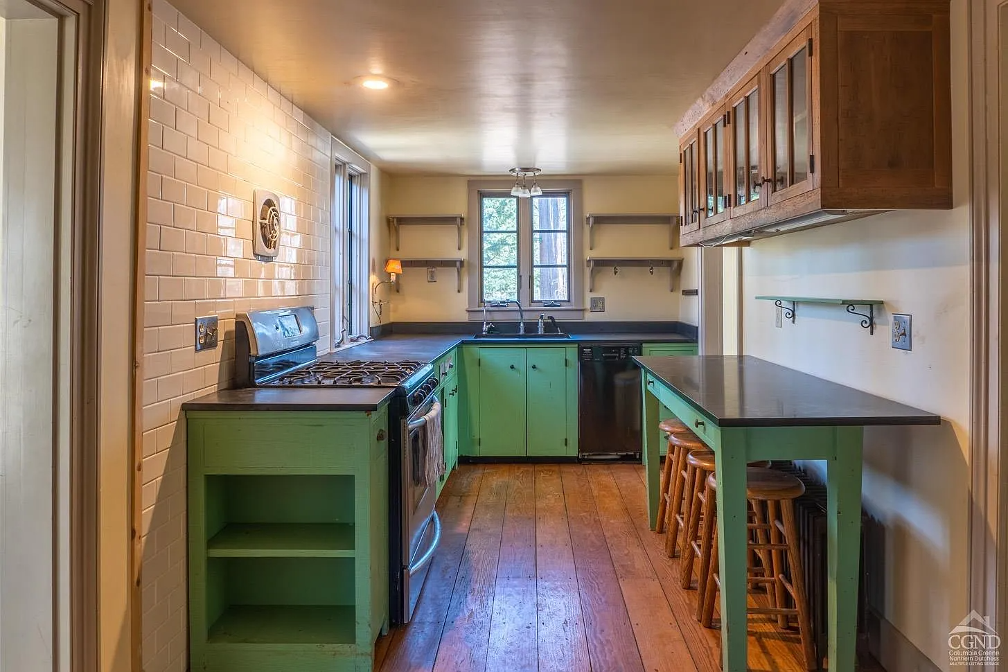 kitchen with bright green lower cabinets