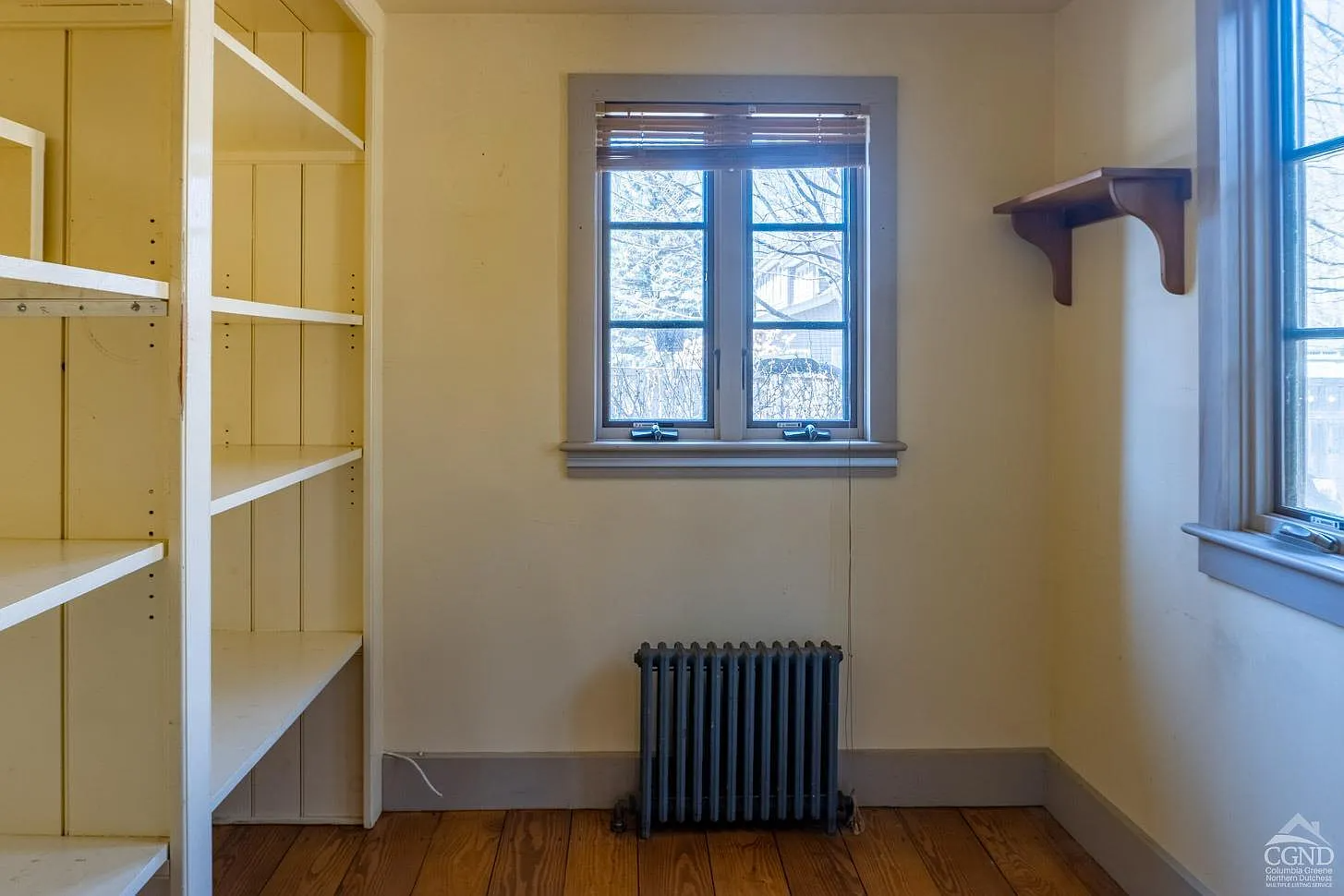 windowed pantry with built-in shelves