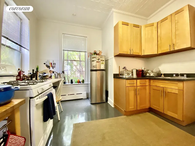 kitchen with wood cabinets, two exposures