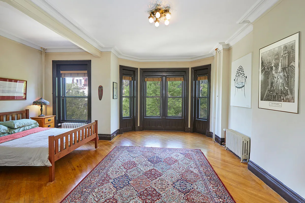 bedroom with bay window, wood floor