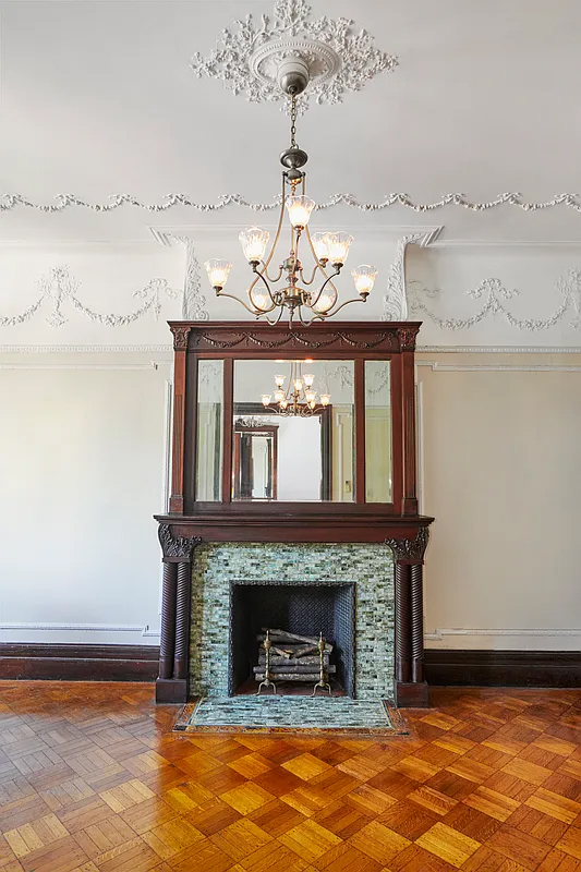 mantel with mirror, blue tile surround,
