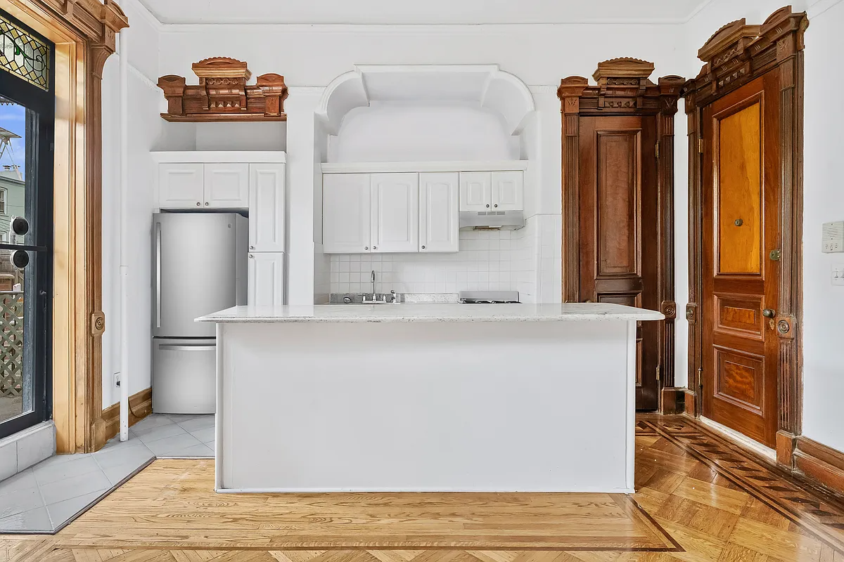 parlor level kitchen with white cabinets