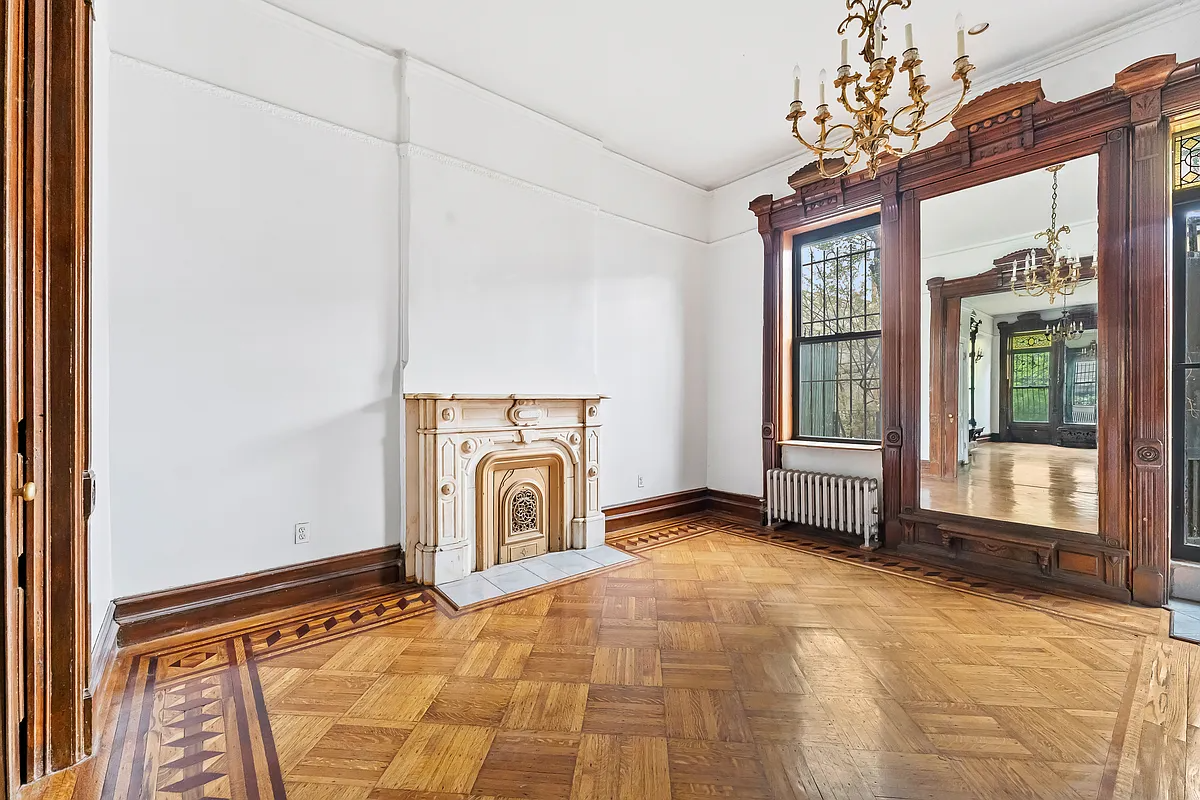 rear parlor with pier mirror, marble mantel, wood floor