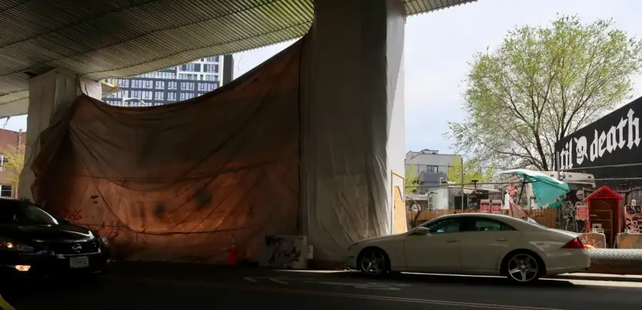 The construction tarp, with Til Death to the right.