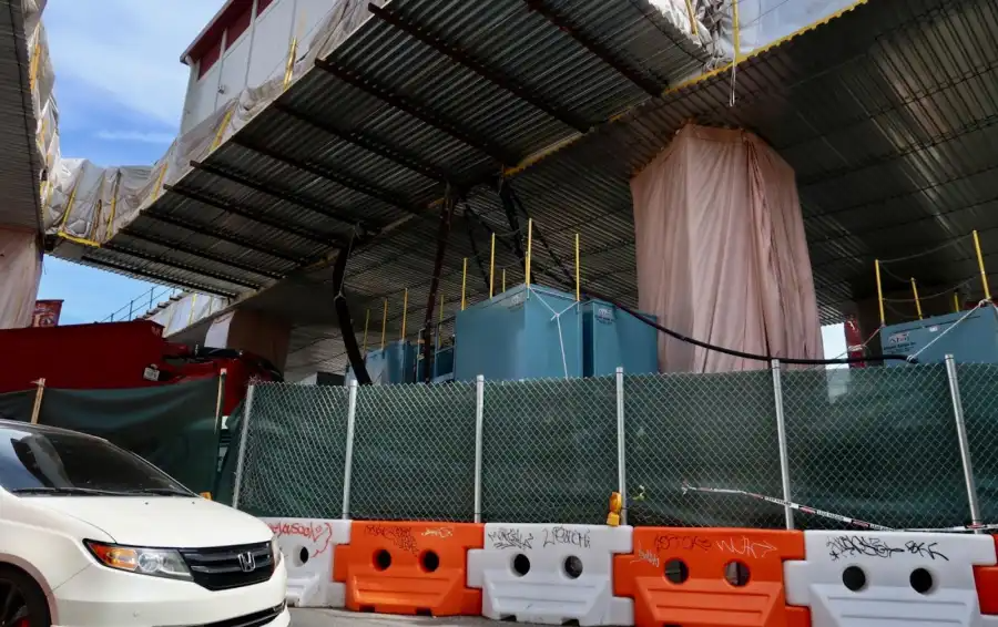 Locals worry the tarps aren’t doing enough to protect them from falling lead dust.