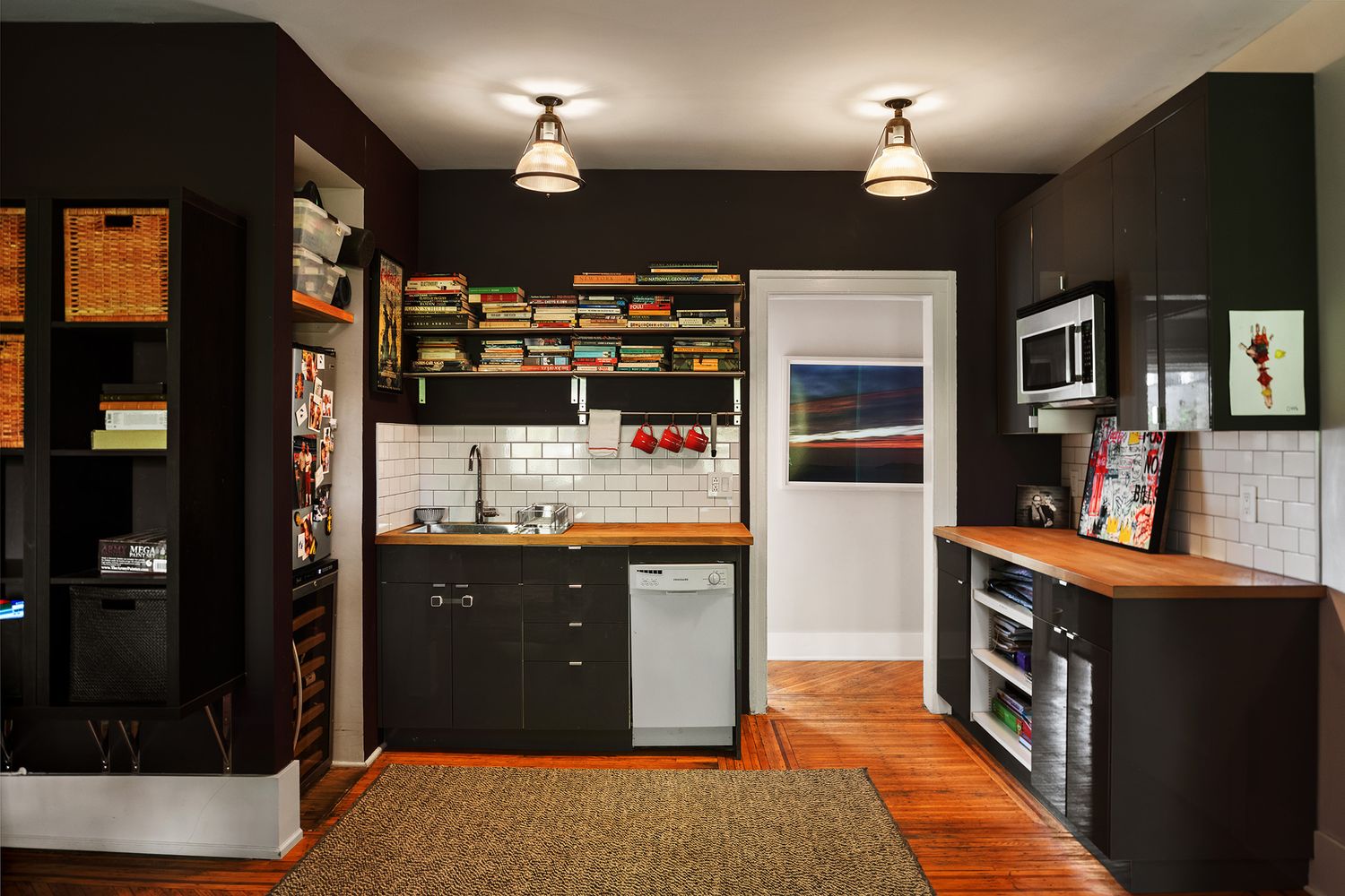 garden level kitchenette with black cabinets
