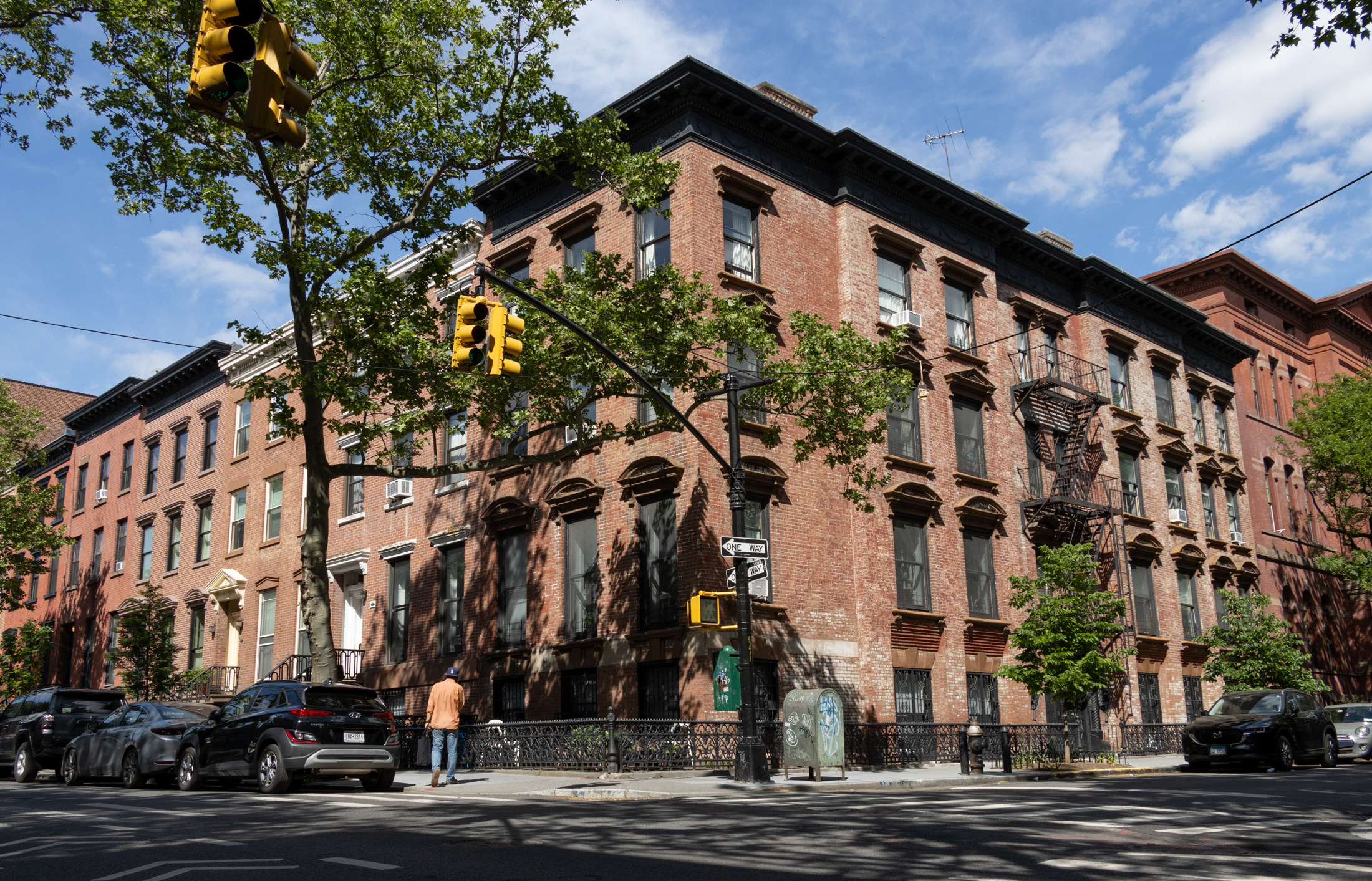 brooklyn - brick row houses wrapping around a corner in cobble hill