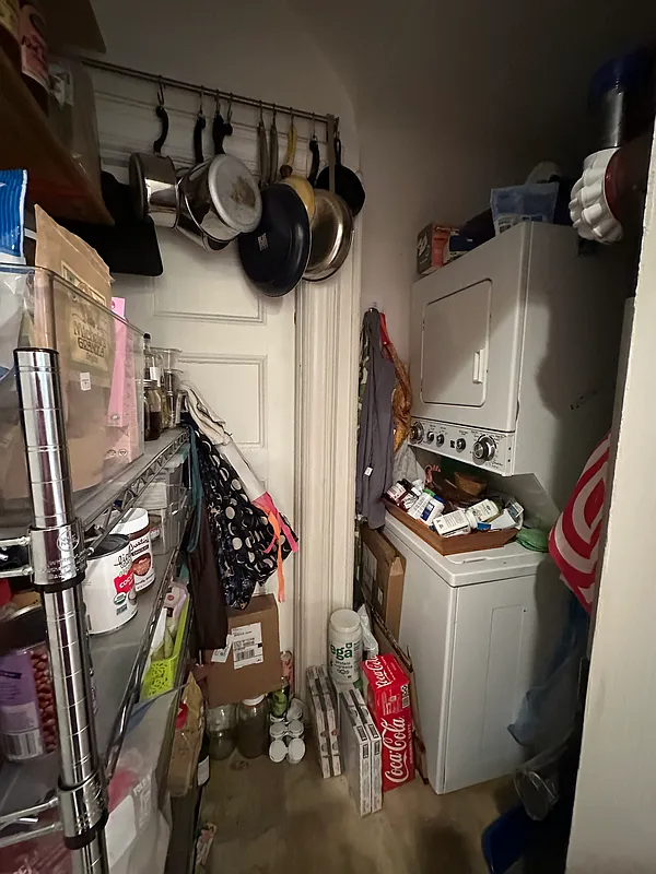 closet with stacked washer/dryer