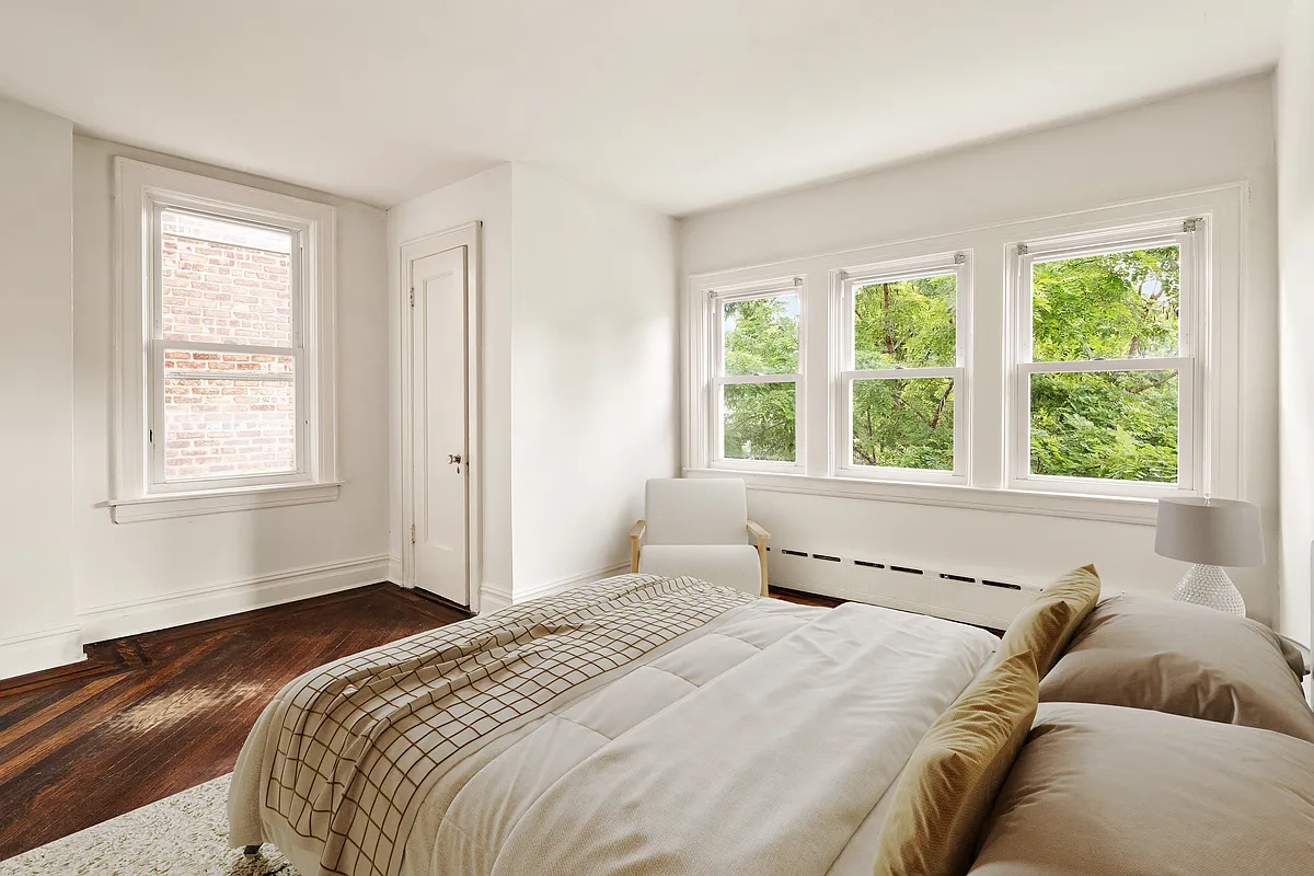 virtually staged bedroom with two exposures, closet