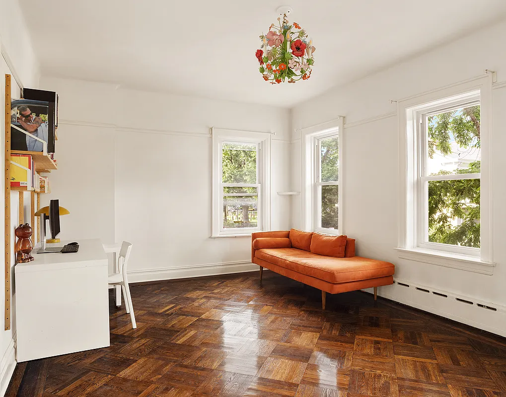 bedroom with two exposures set up as an office