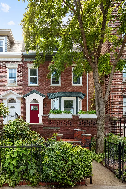 brick exterior with red door