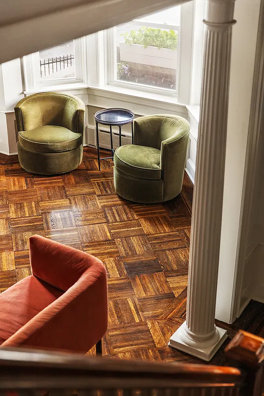look down the stair to the parquet floor in the living room