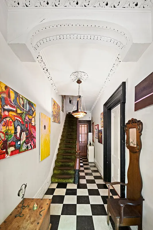 entry hall with plasterwork, checkerboard painted floor,