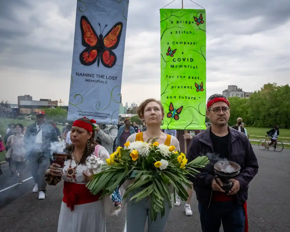 A New Orleans-style procession, led by the Brass Queens, winds through Green-Wood Cemetery during the dedication ceremony for 'A Bridge, a Stitch, a Compass.’