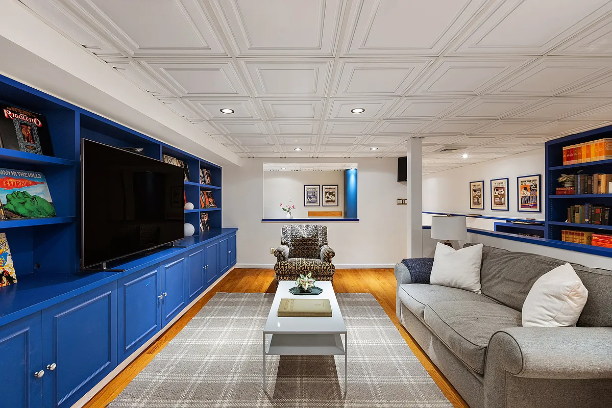 media room with bright blue cabinetry