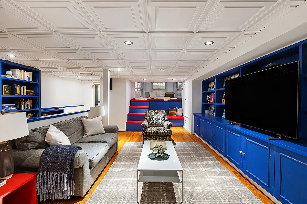 media room with bright blue cabinetry