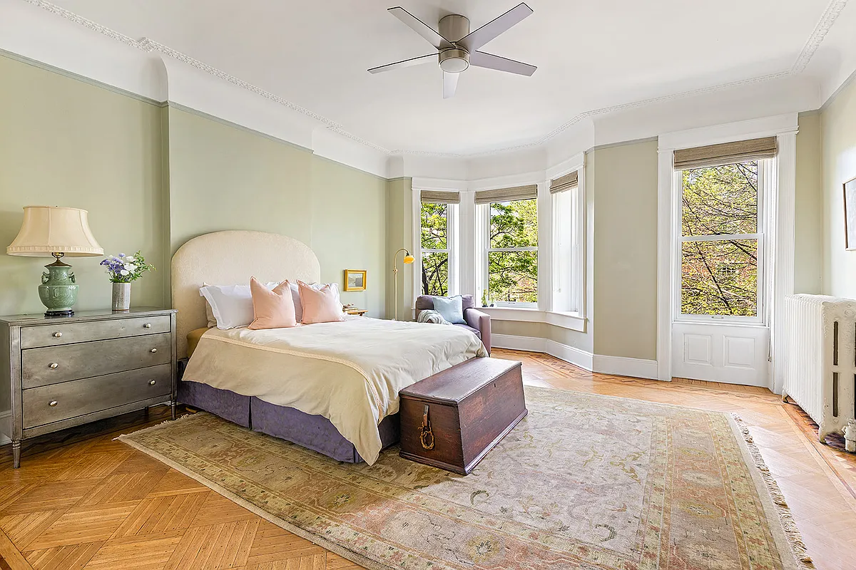 bedroom with wood floor, picture rail