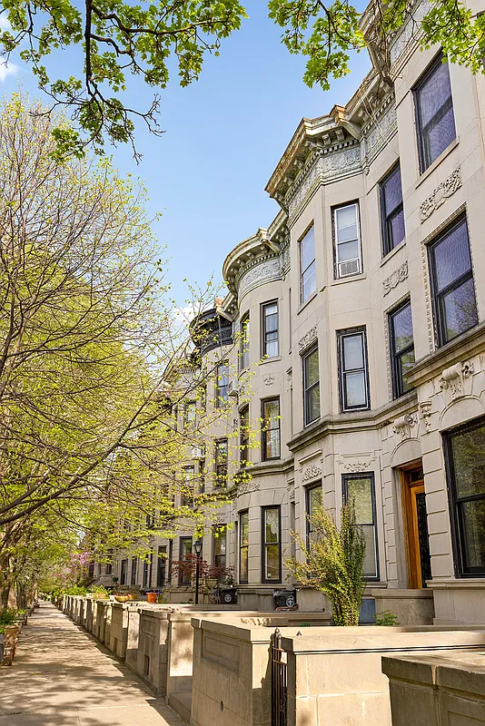 brooklyn - row of limestone houses with angled and rounded bays