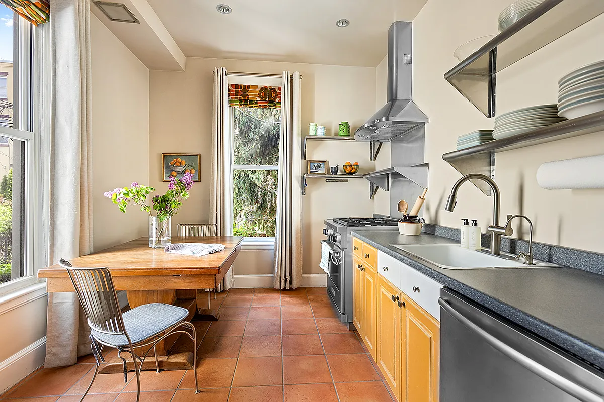 kitchen with terra cotta tile floor, two exposures