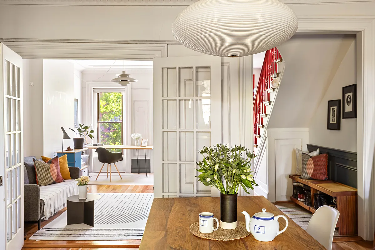 dining room with view of red stair and living room