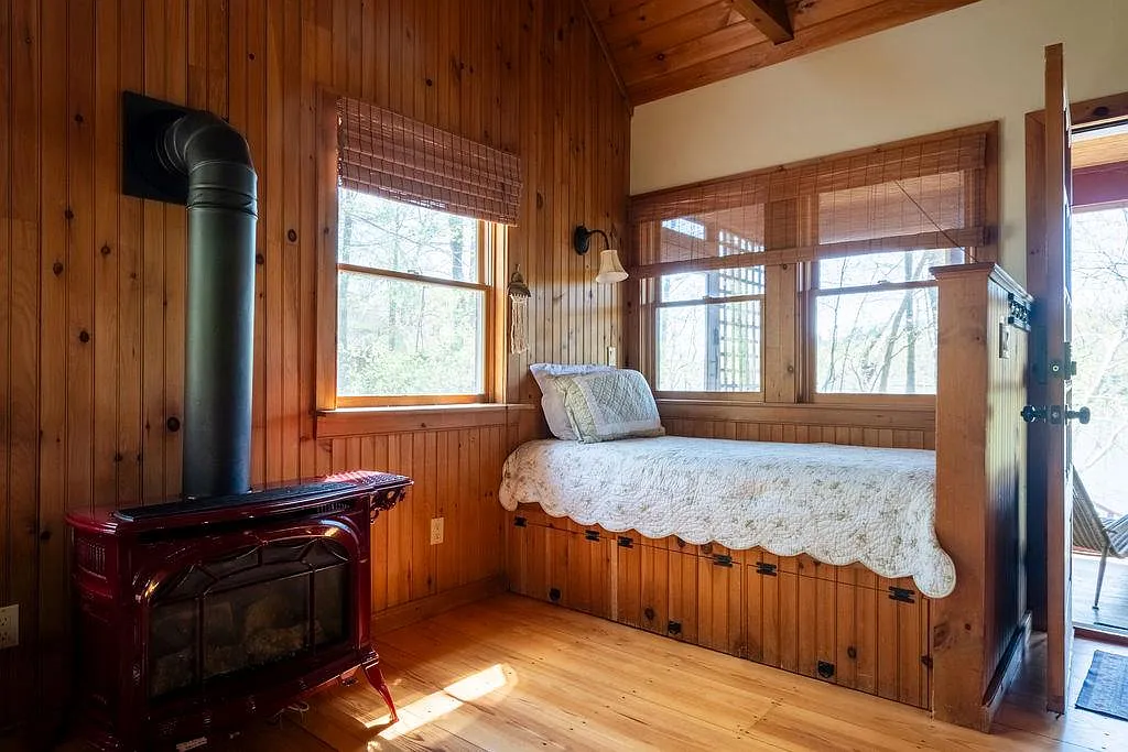 built-in bed in the living area in a cottage