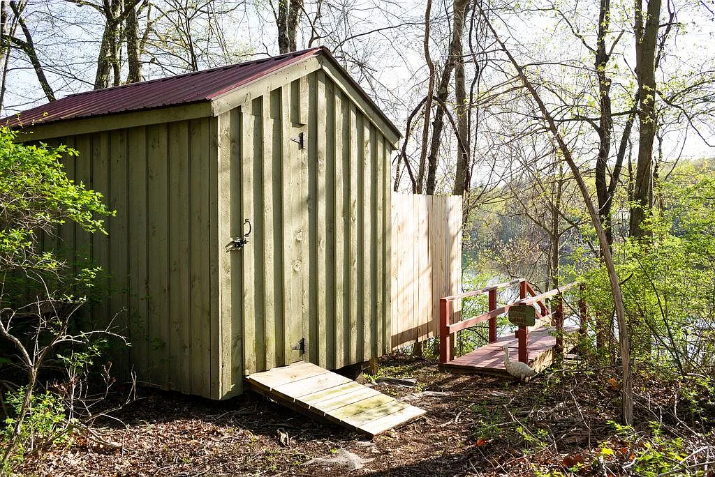 outbuilding next to steps leading down to the lake