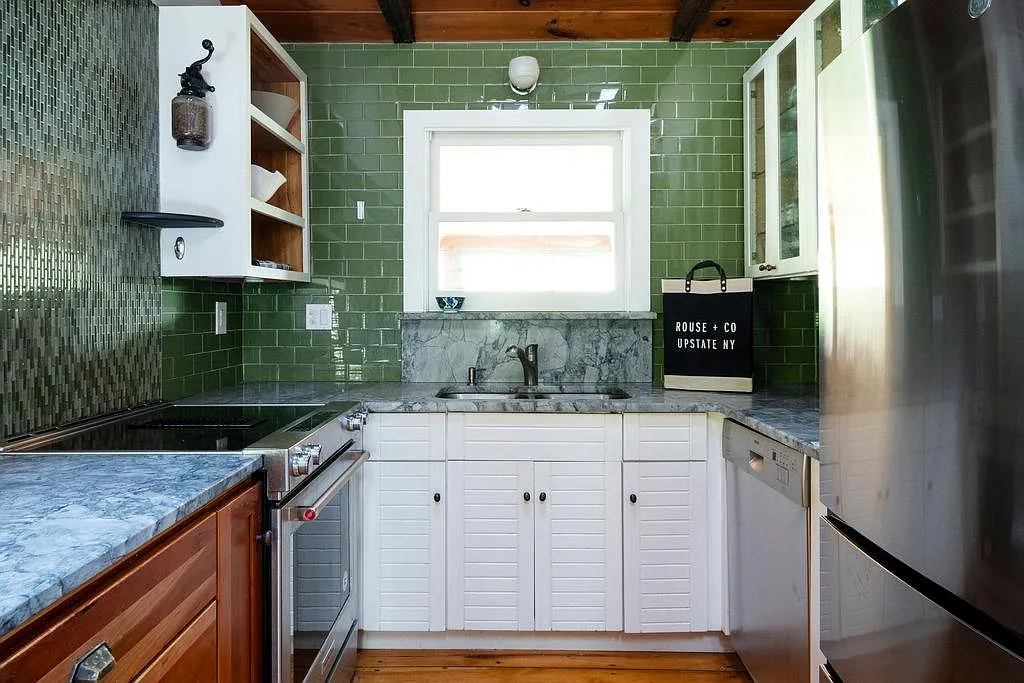 kitchen with green tiles on the walls,