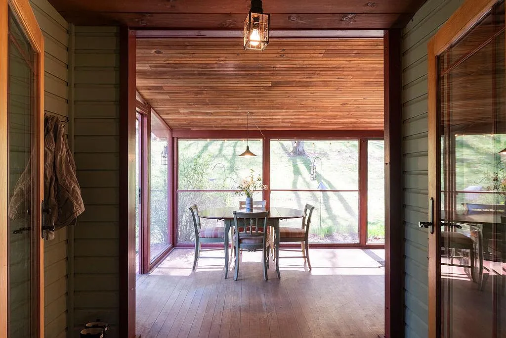 view into screened in porch with room for dining