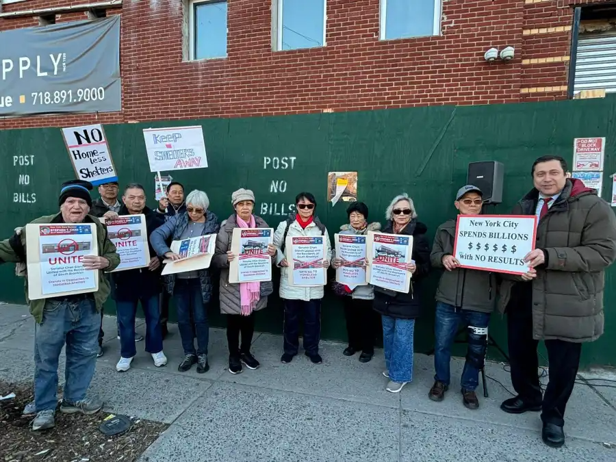 Protesters, including Council candidate Ari Kagan (far right), rally outside the planned shelter site on Coyle Street earlier this year.