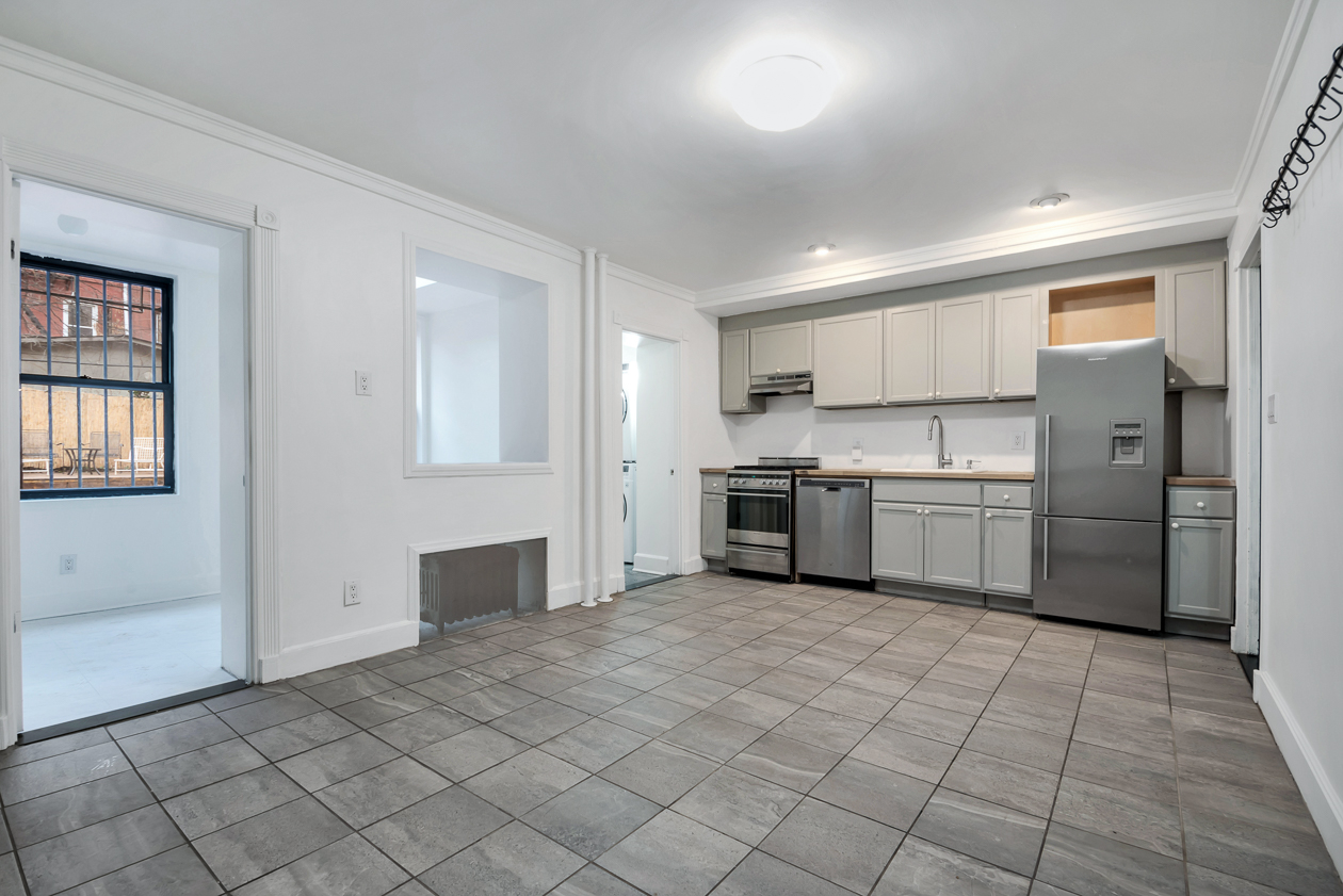 kitchen with gray cabinets and tile floor