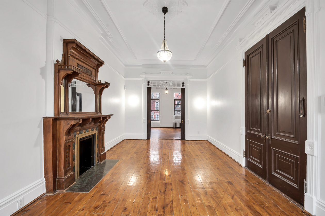 parlor level with wood mantel, fretwork
