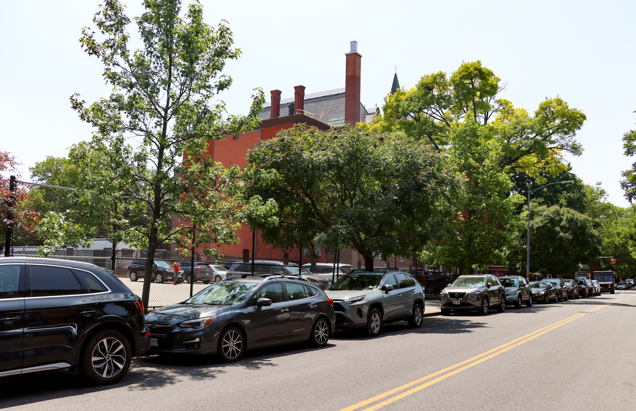 view on halsey street showing the parking lot and the back of the school
