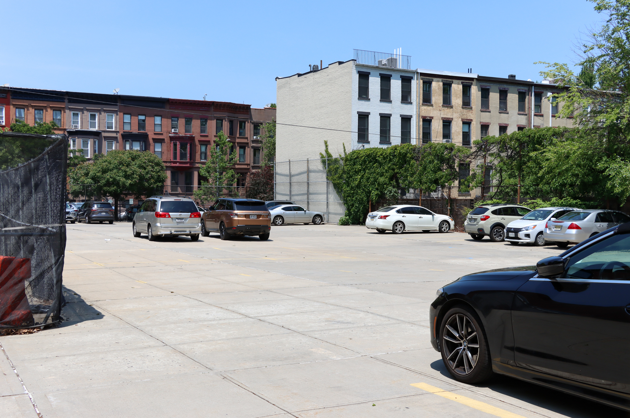 view on macon street of the parking lot behind the school