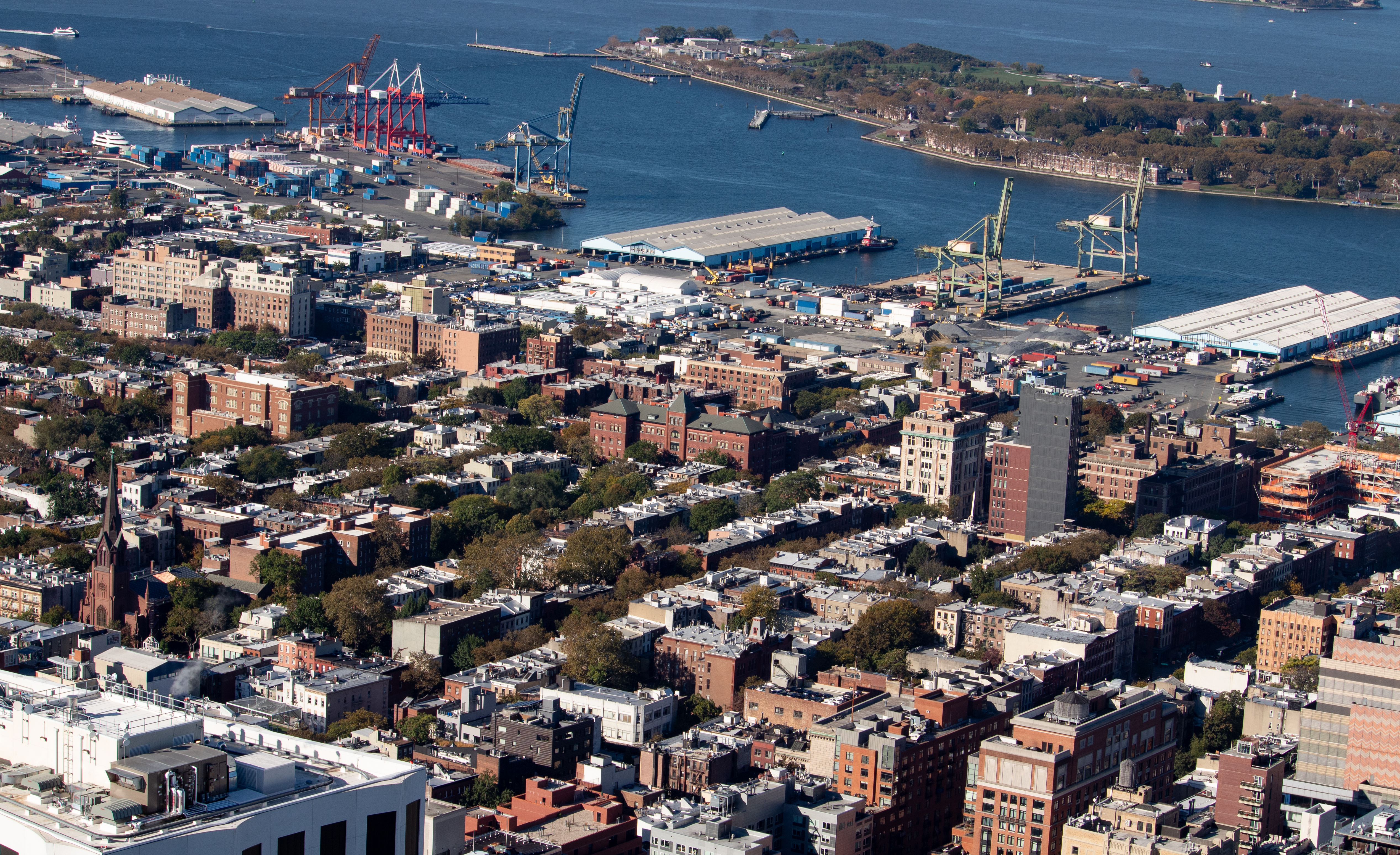 brooklyn - aerial showing piers and cranes on the waterfront stretching to Red Hook