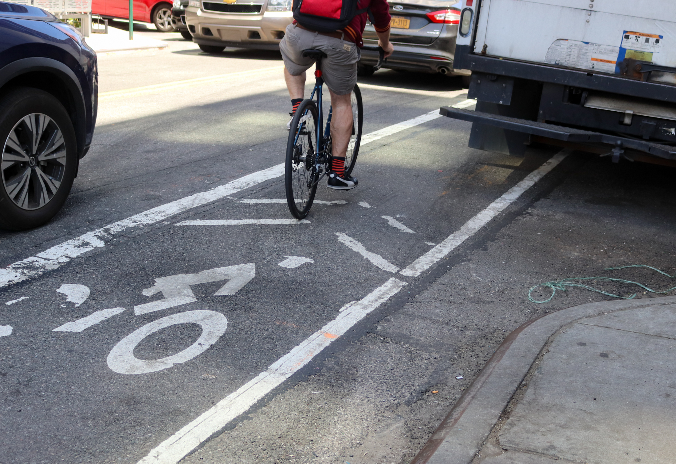 a bike and traffic on a brooklyn street