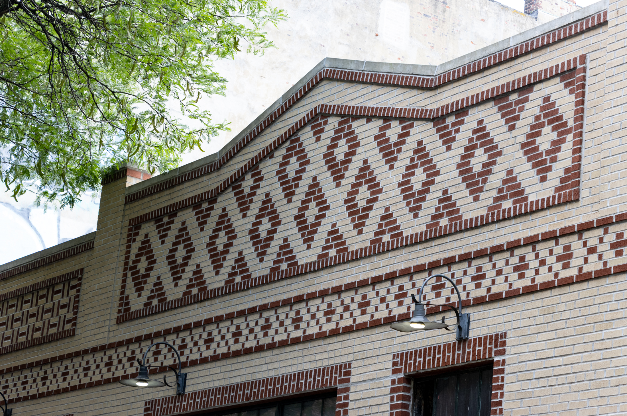 red brick detail on brick garage
