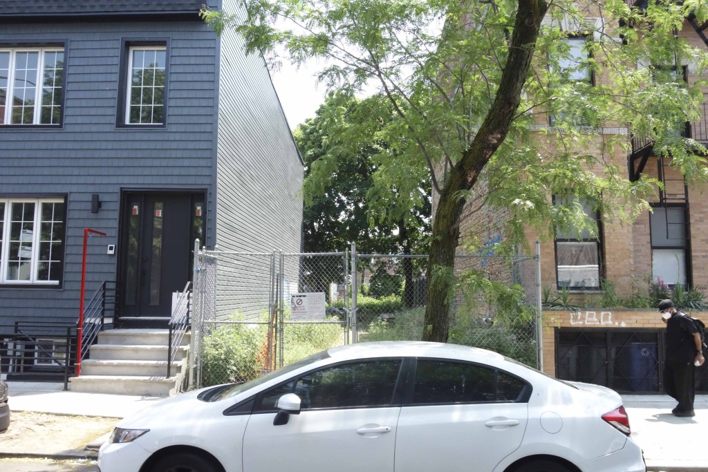 empty lot between two residential buildings