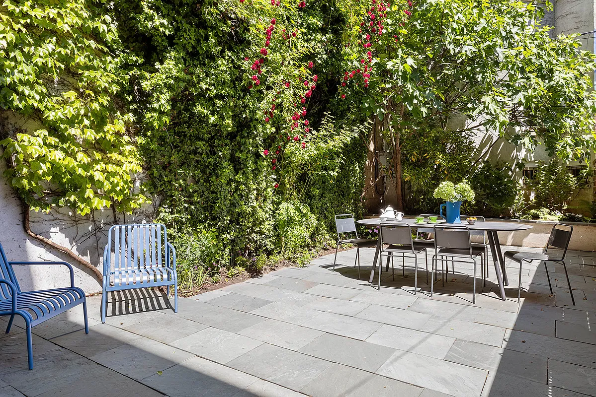 landscaped rear yard with paved patio