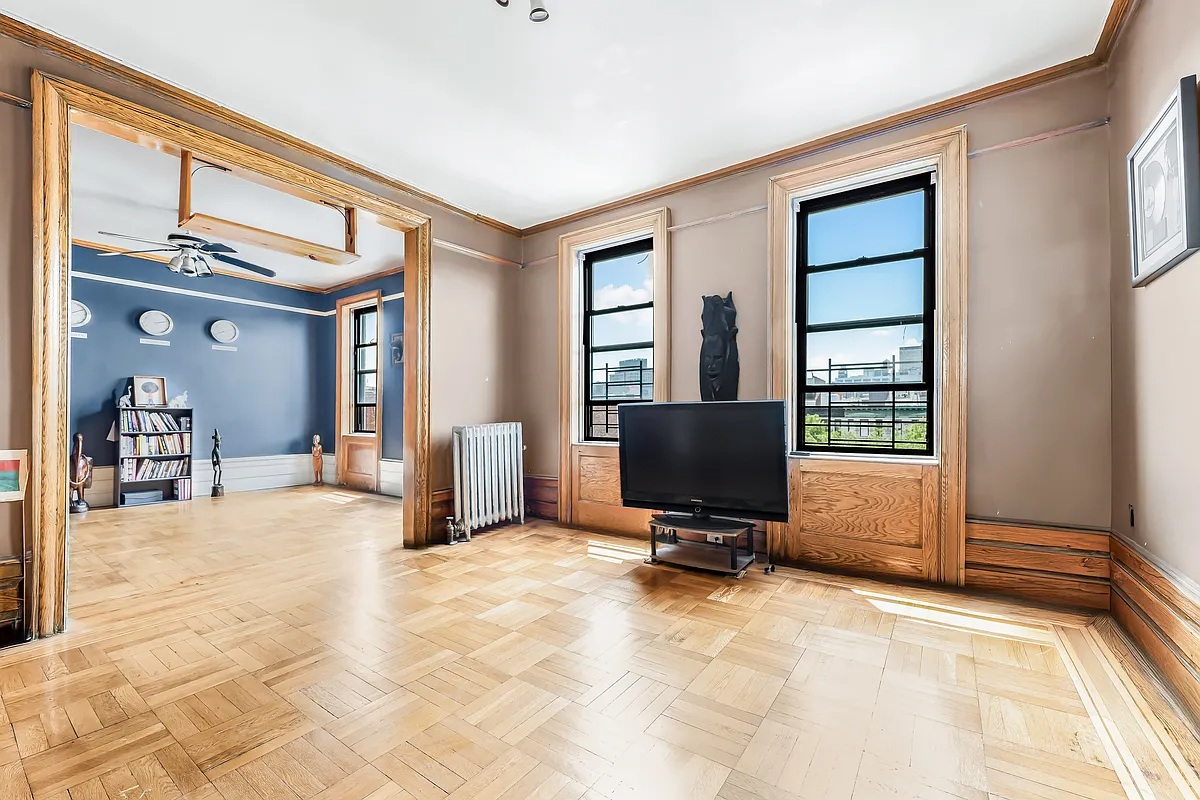 dining room with wood floor, two windows