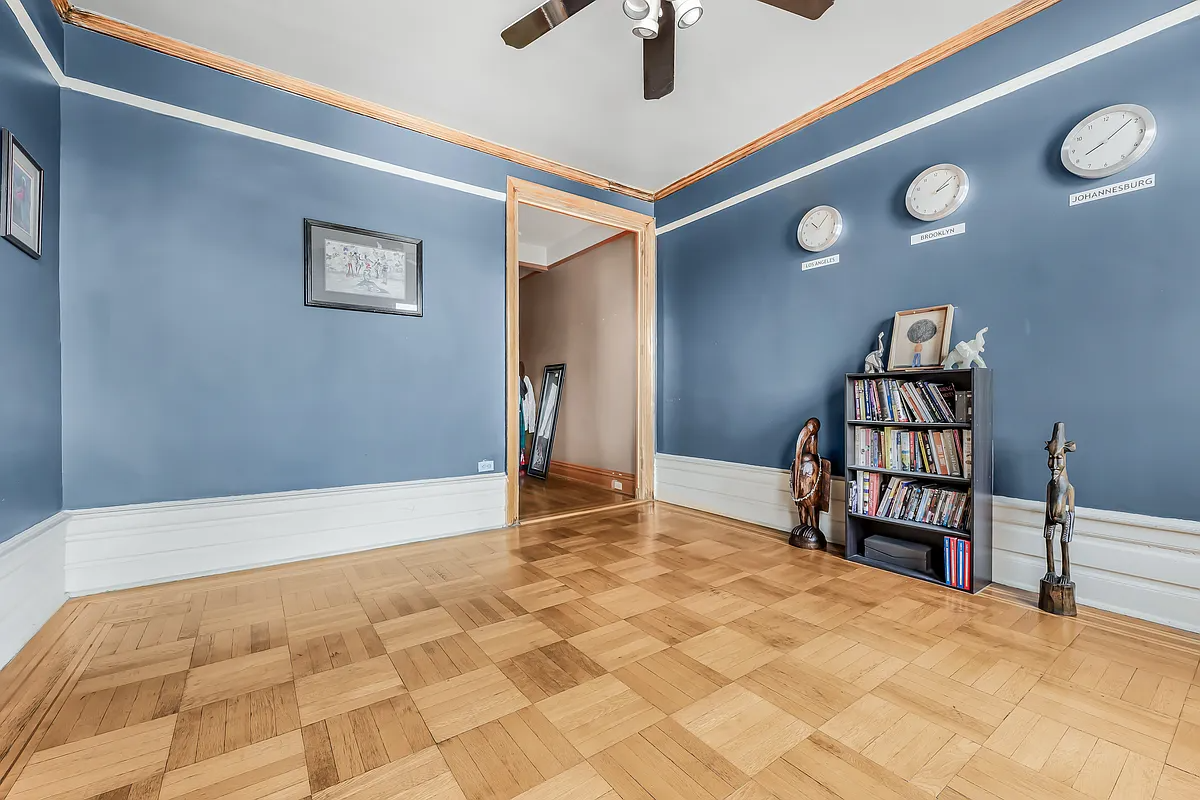 living room with blue walls, ceiling fan